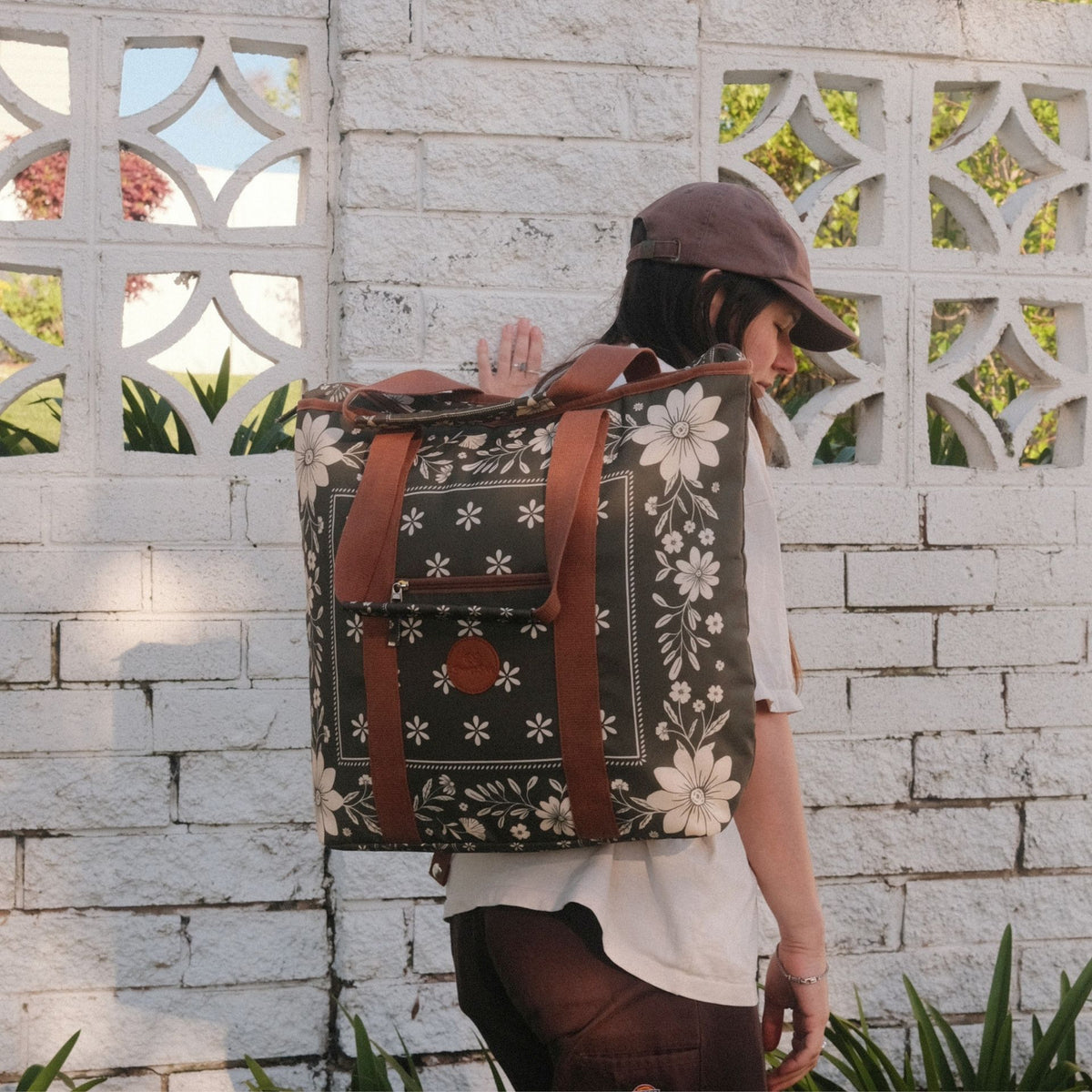 Eden beach tote bag, olive green floral bandana print, worn as a backpack, side view