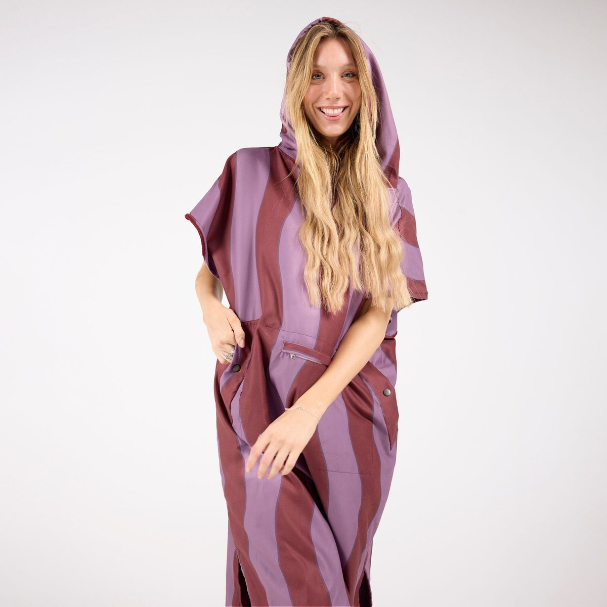 Jagger Shiraz adult hooded towel poncho, burgundy and mauve wavy stripe, front view on model