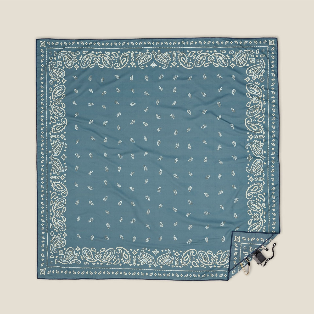 Venice sand free beach towel in XL, dusty blue paisley bandana print, studio flat lay