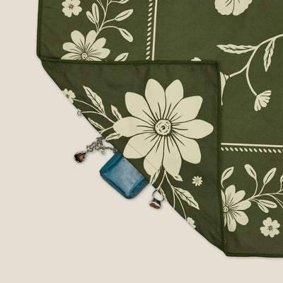 Eden sand free beach towel in Large, olive green floral bandana print, corner detail