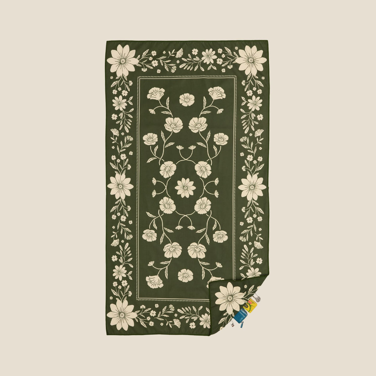 Eden sand free beach towel in Large, olive green floral bandana print, studio flat lay