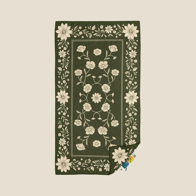 Eden sand free beach towel in Large, olive green floral bandana print, studio flat lay
