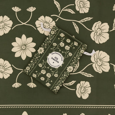 Eden sand free beach towel in Large, olive green floral bandana print, with its carry pouch