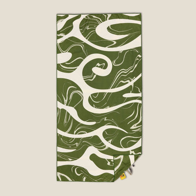 Liquid Dreams sand free beach towel in Large, green and cream marble swirl print, studio flat lay