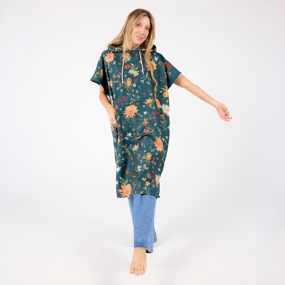 Native Botanical adult hooded towel poncho, dark green Australian wildflower print, full length on model