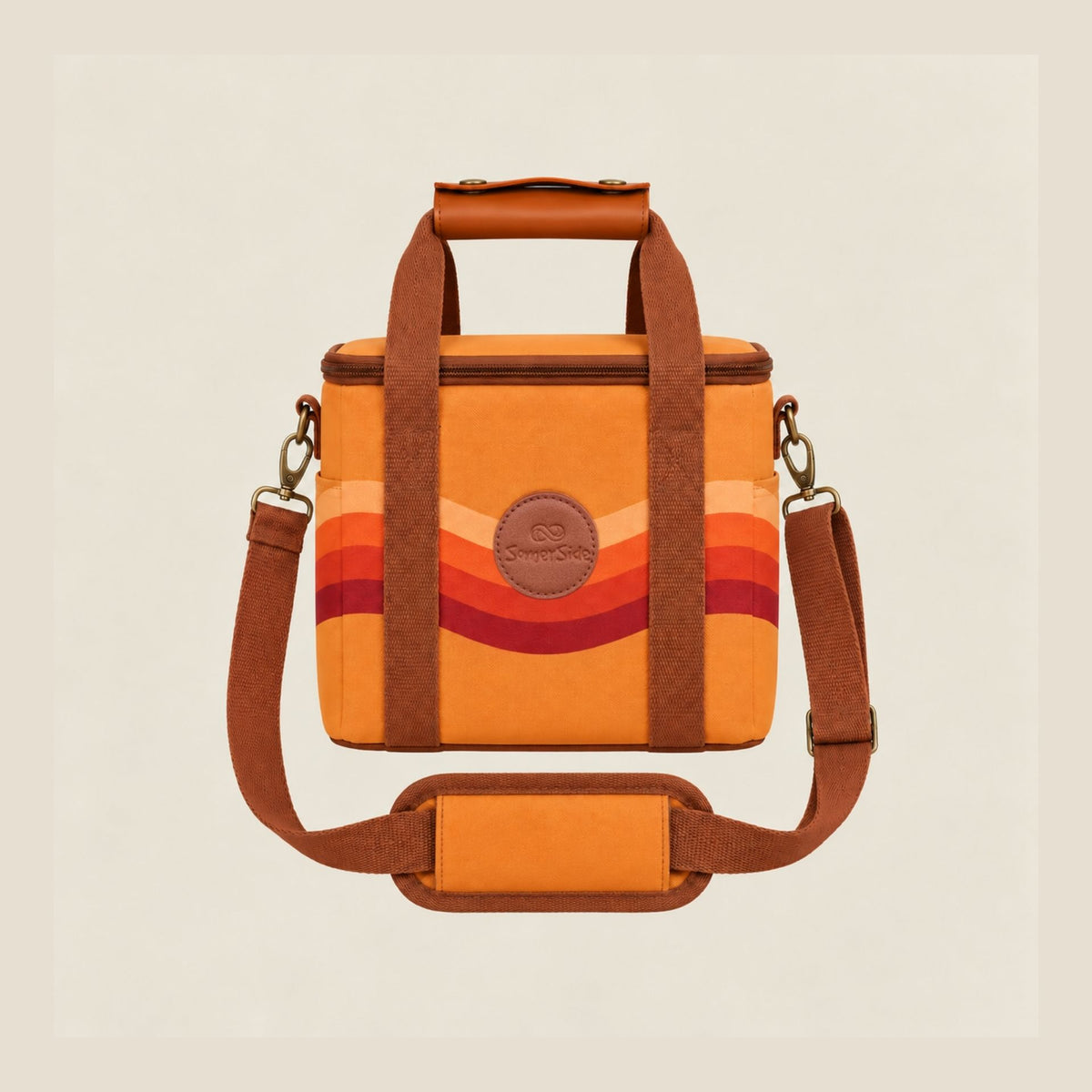 Stevie mini insulated cooler bag, orange retro 70s wave print, studio front view with shoulder strap