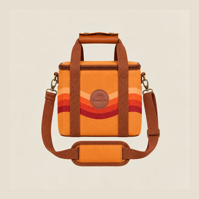 Stevie mini insulated cooler bag, orange retro 70s wave print, studio front view with shoulder strap