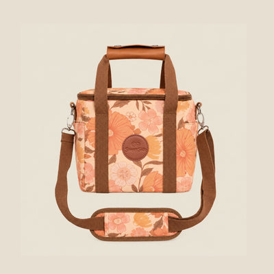 Summer Muse mini insulated cooler bag, peach and butter retro 70s floral print, studio front view with shoulder strap