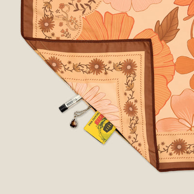 Summer Muse sand free beach towel in Large, peach retro 70s floral print, corner detail