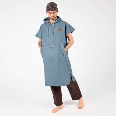 Venice adult hooded towel poncho, dusty blue paisley bandana print, full length on model