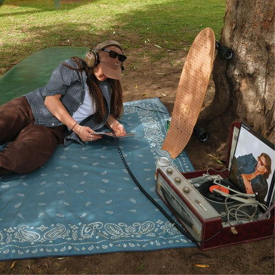 Venice sand free beach towel, dusty blue paisley bandana print, picnic with a record player