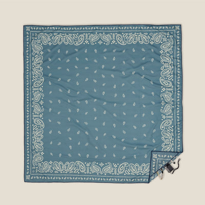 Venice sand free beach towel in XL, dusty blue paisley bandana print, studio flat lay